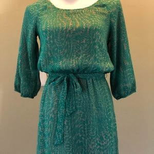 Beautiful dress with silver tinsel throughout...